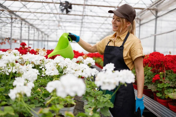 Cheerful Woman Nursery Worker Watering Flowers Watering Can — Stockfoto