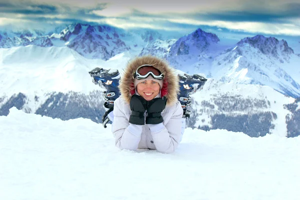 Girl on the snow in mountains — Stock Photo, Image