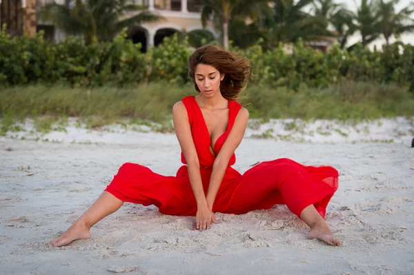 Elegant barefoot woman on a beach — Stock Photo, Image