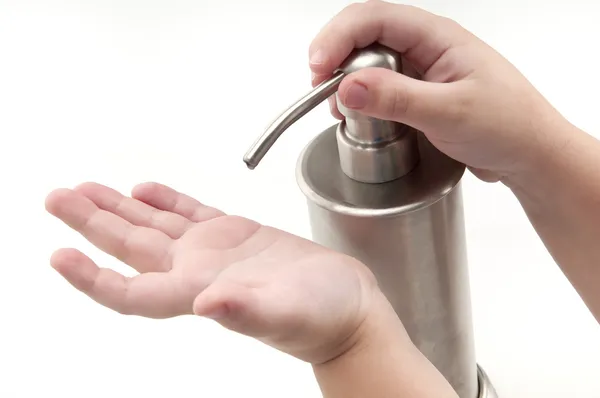 Kid hands pouring sanitizer — Stock Photo, Image