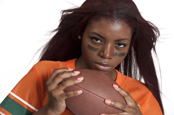 Woman holds american football ball — Stock Photo, Image