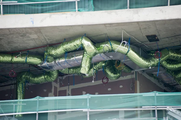 Installing Green Air Conditioning Duct Work of a Commerical Building