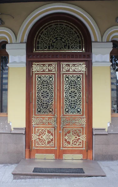 Delicate cast metallic door — Stock Photo, Image