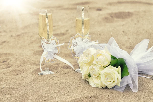 Wedding glasses on sand — Stock Photo, Image