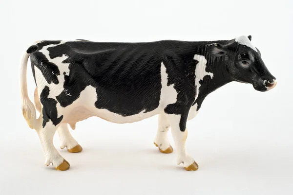 Giocattolo mucca isolato su uno sfondo bianco — Foto Stock