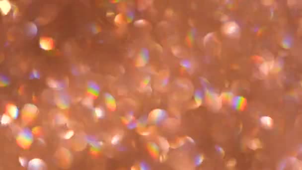 Абстрактний блискучий блиск 4k відео фон Золотий та помаранчевий блискучий фон з блискучою текстурою Золоте мерехтливе світло, блискітки і блискучі блискучі фольги — стокове відео