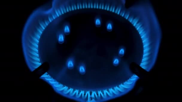 Gas stove being turned on isolated on black background. Natural gas deficit concept. Top view. 4k resolution video — Video