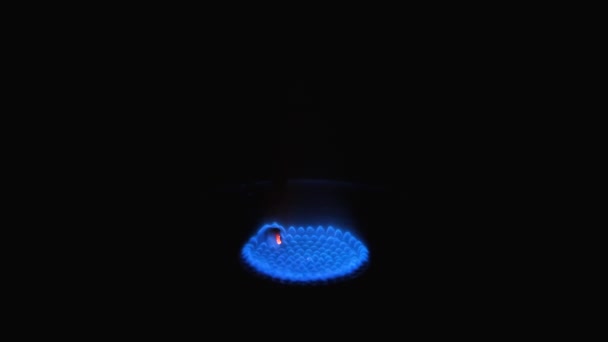 Gas stove being turned on isolated on black background. Natural gas deficit concept. Full HD slow motion video. — Stock video