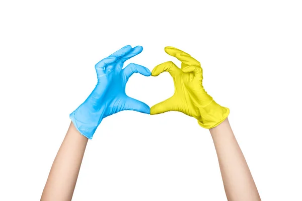 Les mains tonifiées dans les couleurs du drapeau ukrainien forment un geste cardiaque. Stop à la guerre en Ukraine concept — Photo