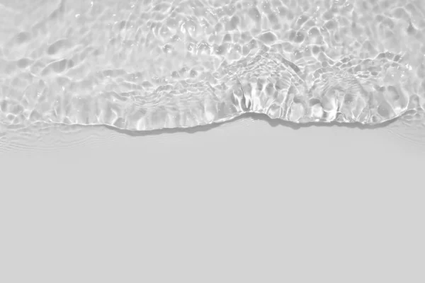 Light gray transparent clear calm water surface texture with splashes, waves and bubbles. Trendy abstract nature background with shadows and lights reflection. Water waves in sunlight. Overlay effect.