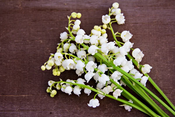 Lily of the valley on a board — Stock Photo, Image