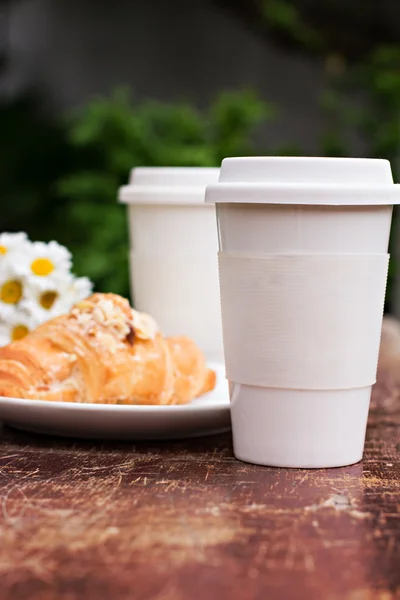 A glass of coffee and croissant — Stock Photo, Image