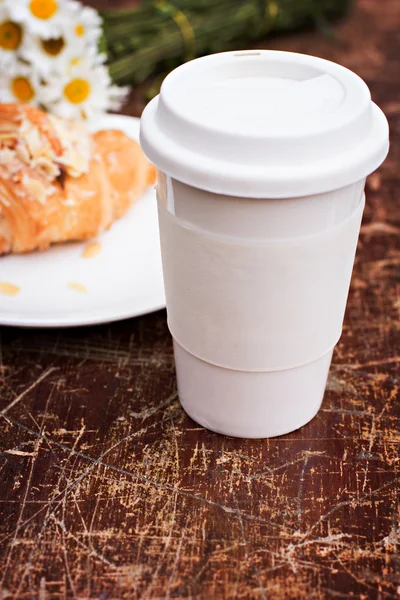 A glass of coffee and croissant — Stock Photo, Image