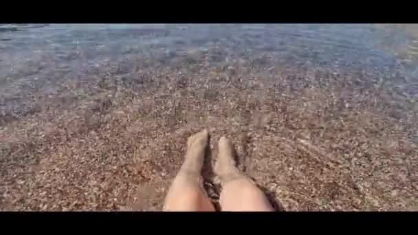 View Female Legs Transparent Sea Water Woman Relaxes Seashore Sorting — Stockvideo