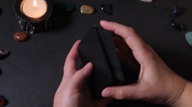 Tarot Reader Hands Shuffling Tarot Cards. Esotericism and forecasting the future