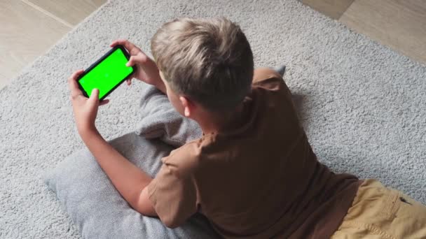Pre Teenager Boy Watching Content Playing Mobile Game Phone Home — Stock Video