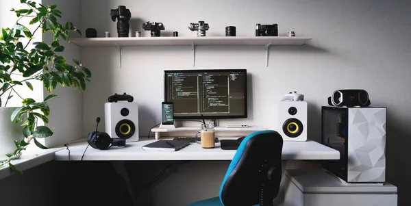 Empty modern developer workplace for writing code with computer desktop and comfy armchair — Stock Photo, Image