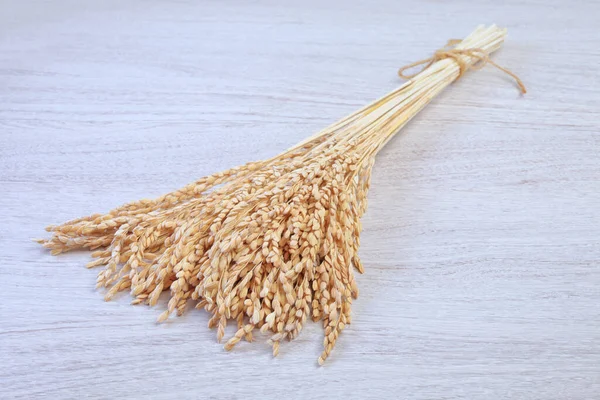 Bunch Rice Ears Isolated Wooden Background — Photo