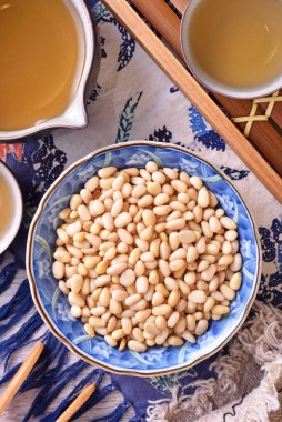 Pine nuts on the wooden table. Healthy food. 