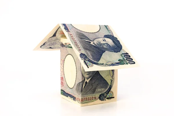 Japanse Yen Bankbiljetten Papieren Huis Witte Achtergrond Begrip Vastgoedbelegging — Stockfoto