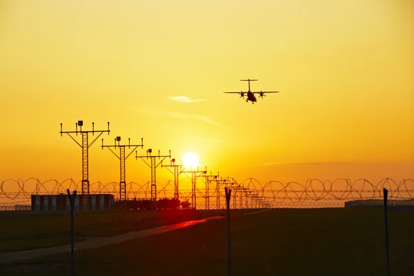 Airplane at the sunset — Stock Photo, Image