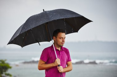 Man in heavy rain clipart