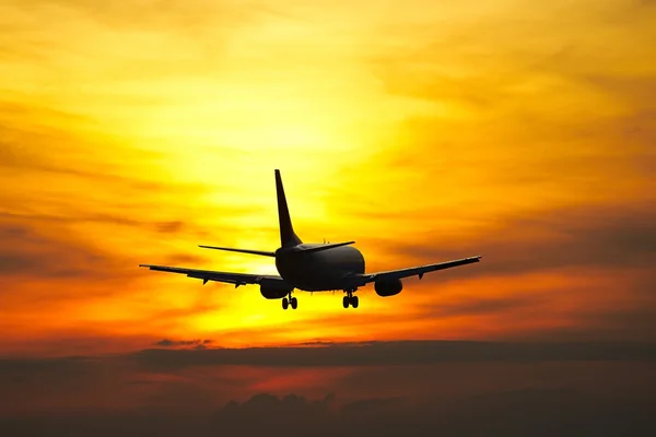 Airplane at the sunset — Stock Photo, Image
