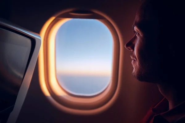 Portrait Man Traveling Airplane Passenger Looking Plane Window Flight Sunrise — Stock Photo, Image