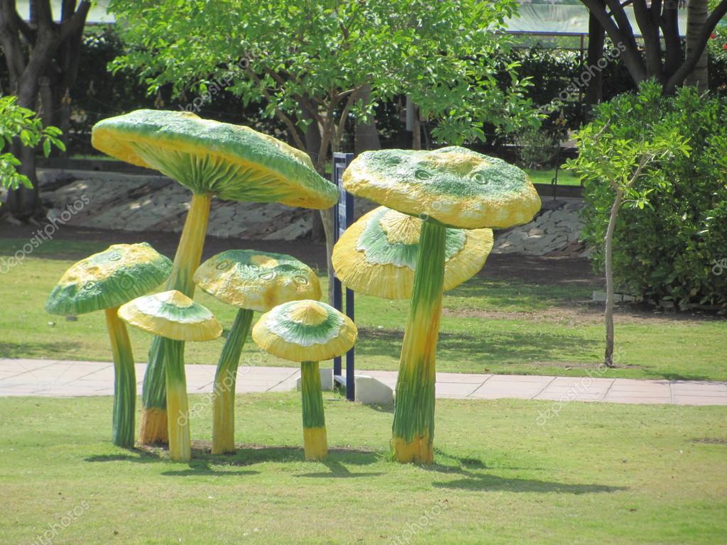 Artificial mushrooms in garden — Stock Photo © sangy 23759783