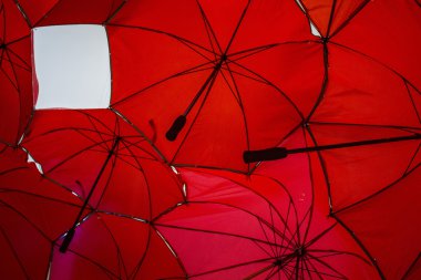 Red umbrellas background