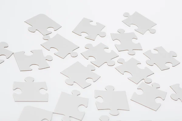 Beyaz jigsaw puzzle parçaları — Stok fotoğraf
