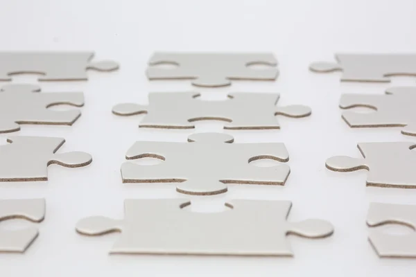 Jigsaw puzzle parçaları satırları — Stok fotoğraf