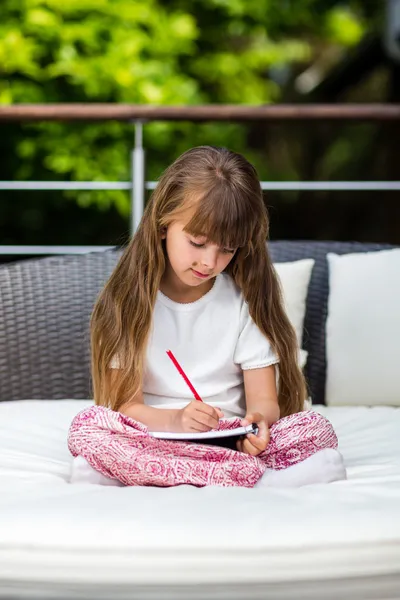 Girl taking notes — Stock Photo, Image
