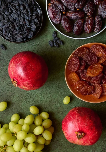 Dried Fruits Apricots Raisins Dates Red Pomegranates Grape Close Green —  Fotos de Stock