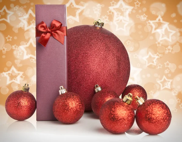 Red Christmas gift box and baubles — Stock Photo, Image