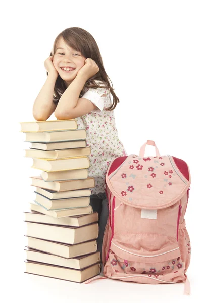 Schoolgirl with book backpack Royalty Free Stock Photos