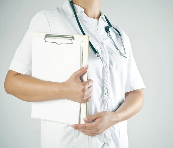 A Young Doctor with stethoscope and notebook — Stock Photo, Image