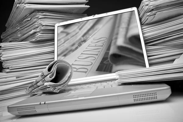 Laptop and newspaper — Stock Photo, Image