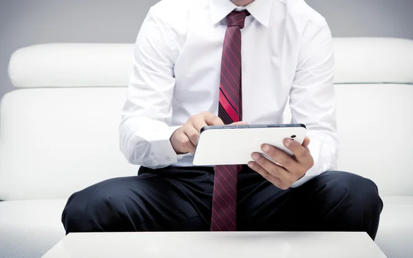 Businessman working on tablet Stock Photo