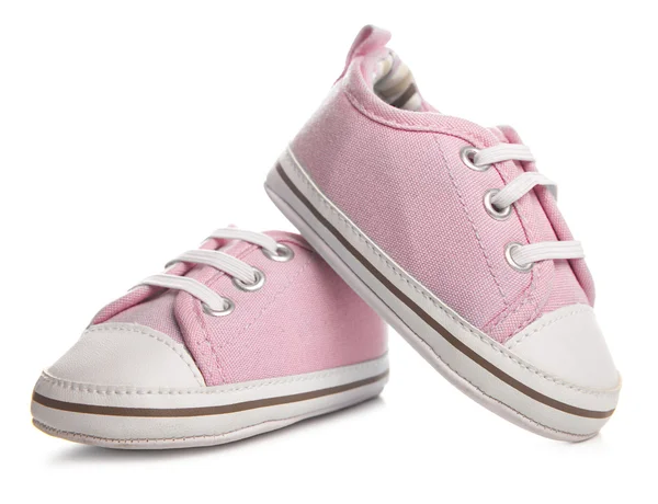 Rosa baby sneakers på vit bakgrund — Stockfoto