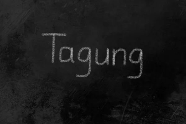 Tagung written on a blackboard — Stock Photo, Image