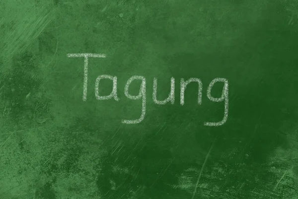 Tagung geschreven op een schoolbord — Stockfoto