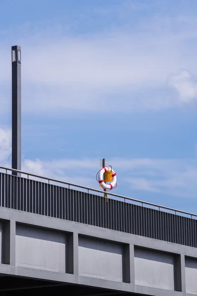 Boya salvavidas en un puente —  Fotos de Stock