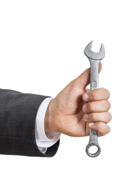 Business man hand with wrench — Stock Photo, Image