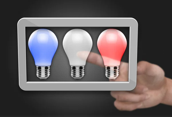 Light bulb in computer tablet — Stock Photo, Image