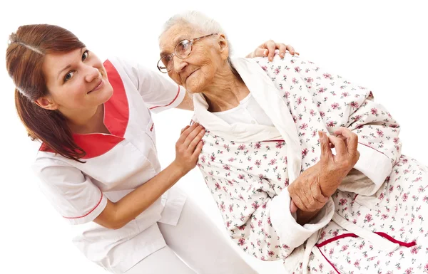 Medical care for an old woman — Stock Photo, Image