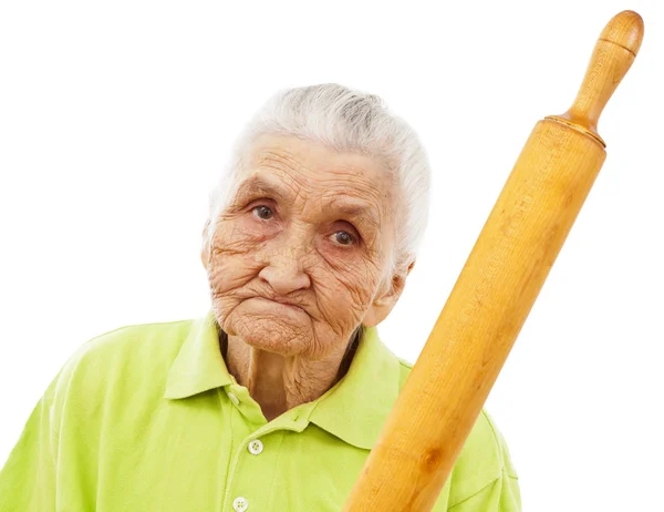 Angry old woman threatening with a rolling pin — Stock Photo, Image