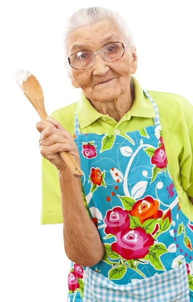 Happy old woman with wooden spoon — Stock Photo, Image