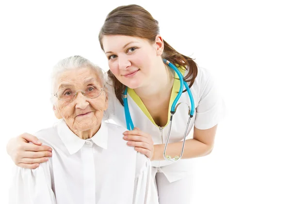 Doctor taking care of an old lady — Stock Photo, Image