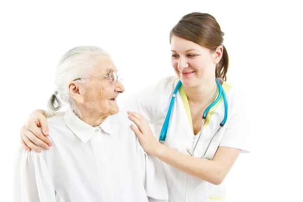 Doctor taking care of an old lady — Stock Photo, Image
